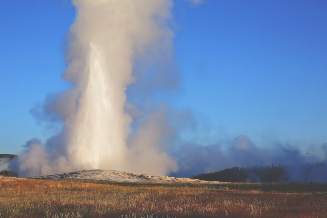 Old Faithful geyser erupting at Yellowstone National Park